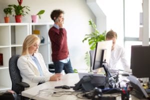 business team with smartphones at office